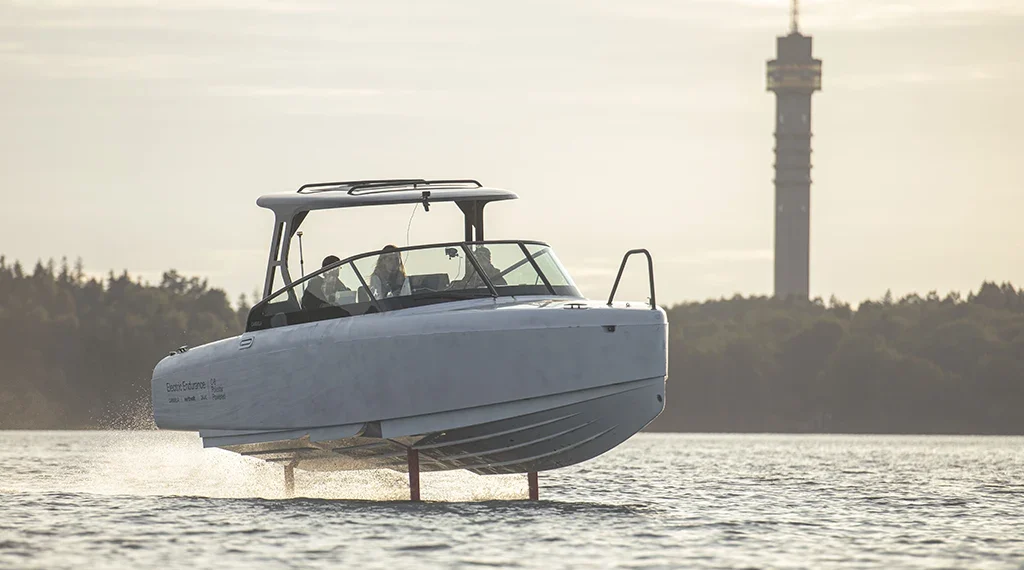 A view of the Candela electric boat cutting across the water
