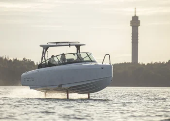 A view of the Candela electric boat cutting across the water