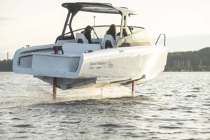 A rear view of the candela electric boat cutting across the water