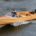Person rides Giesler boat across calm waters