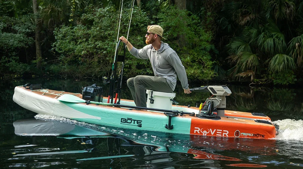 A man using Newport's new NT300 kayaking on a lake