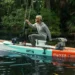 A man using Newport's new NT300 kayaking on a lake