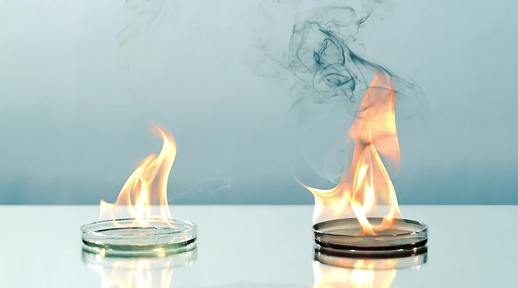 Photo demonstrating the benefit of Renewable Diesel vs Fossil Diesel burning