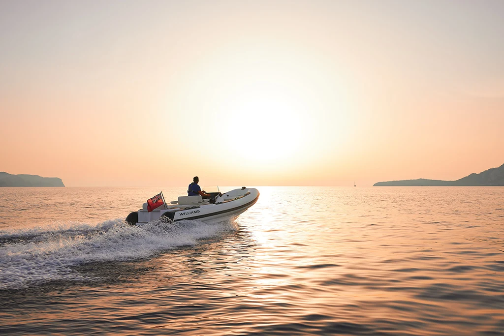 A Williams Jet Tender cruising into the sunset